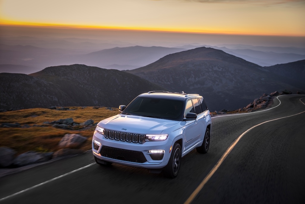 3/4 front view of the 2024 Jeep Grand Cherokee 4xe PHEV on the road.