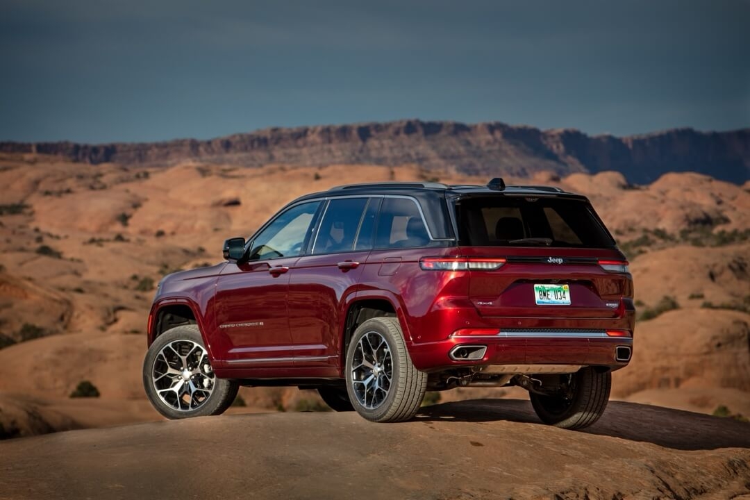 Back 3/4 view of the 2025 Jeep Grand Cherokee parked in a desert.